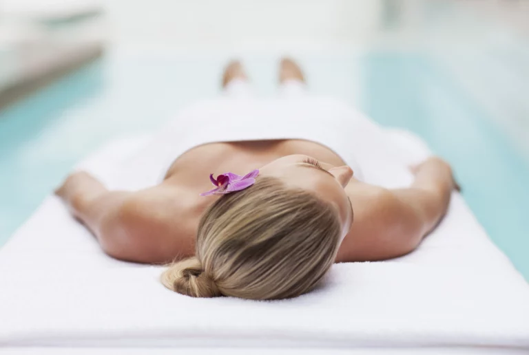 woman on a lounger in the spa of a wellness hotel